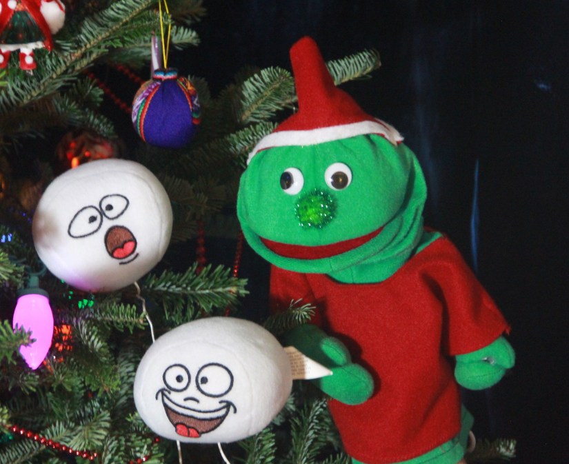 Rutherford the Electronics elf with a couple of carol-singing snowballs from PICCADILLY HOLIDAY