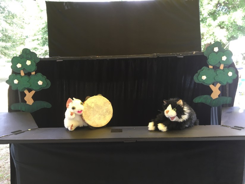 Mouse puppet with a Tamborine and cat puppet from Cat and Mouse Tales