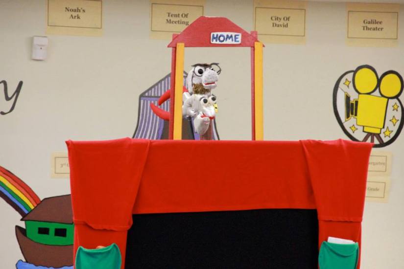 Hammer and Pliers puppets over backdrop