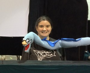 Puppeteer Lorie Summers with the Eel rod puppet