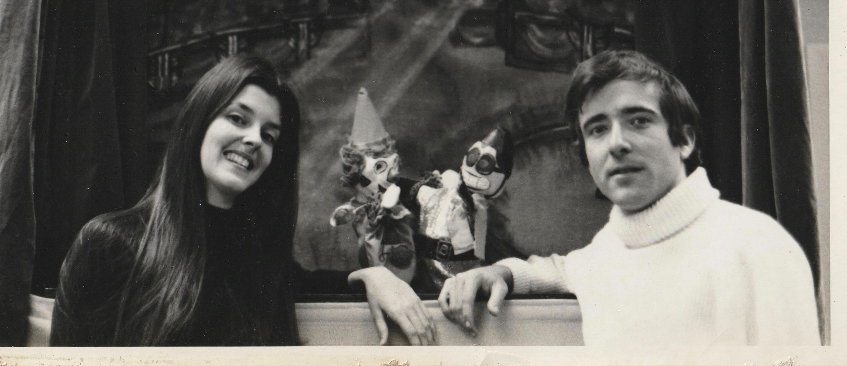 Woman and a Man with puppets in the puppet stage