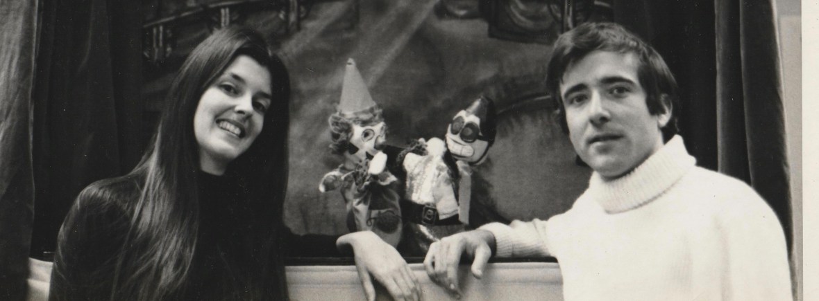 Woman and a Man with puppets in the puppet stage